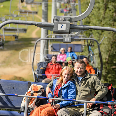 Couple hugging on romantic chairlift trip