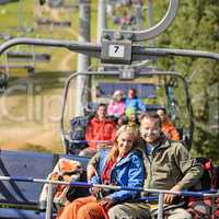 Couple hugging on romantic chairlift trip