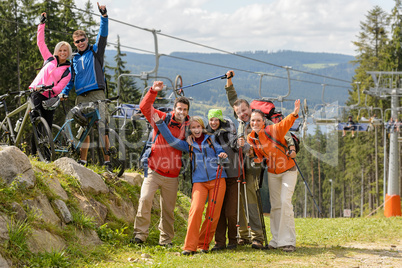 Happy hikers reaching their goal mountain top