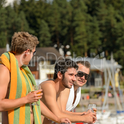 Young guys at beach drinking beer