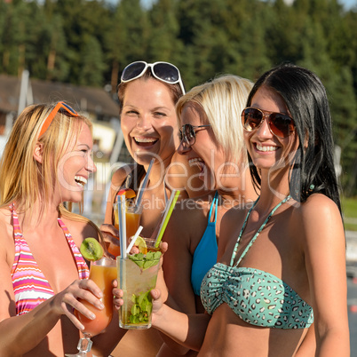 Young women in bikini partying with cocktails