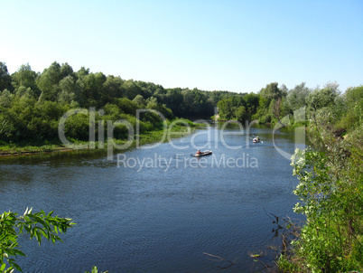 beautiful landscape with river and canoe on it