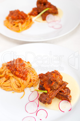 pasta with pork ribbs sauce on polenta bed