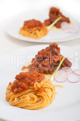 pasta with pork ribbs sauce on polenta bed