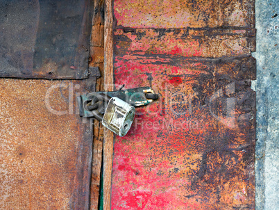 Old padlock on the door of the barn