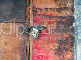Old padlock on the door of the barn