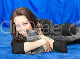 beautiful girl with a cat on hands