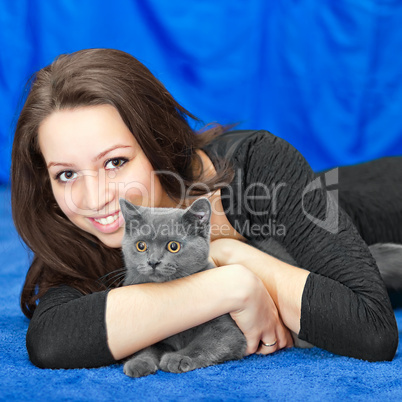 beautiful girl with a cat on hands