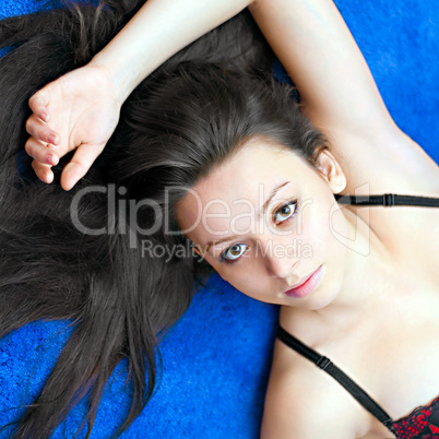 portrait of a young girl on blue background