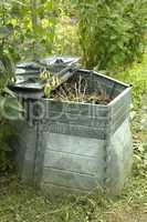 compost barrel in a garden