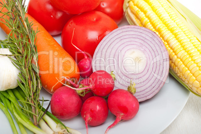 fresh vegetables and herbs on a plate