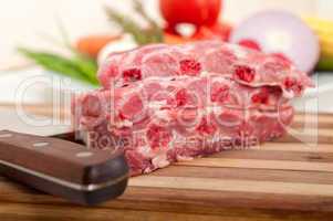 chopping fresh pork ribs and vegetables