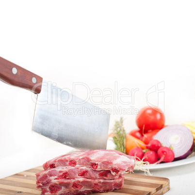 chopping fresh pork ribs and vegetables