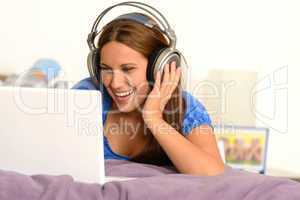 Young girl watching movie on laptop