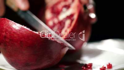 Cutting the pomegranate.