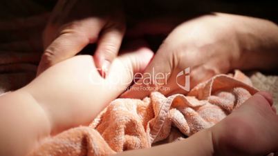 Father massages the kid's feet.