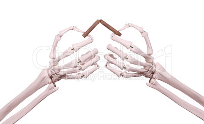 skeleton hands with broken cigar