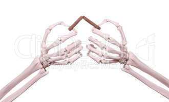 skeleton hands with broken cigar