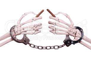skeleton hands with handcuff holding broken cigar