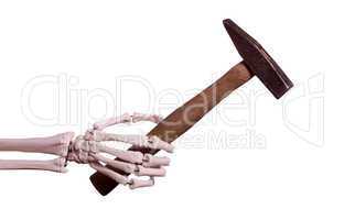skeleton hand with old hammer