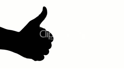 Silhouette of hand giving thumb up on white background.