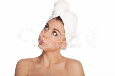 woman standing thinking in a towel