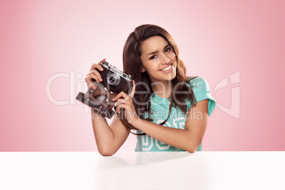 beautiful woman with a vintage camera