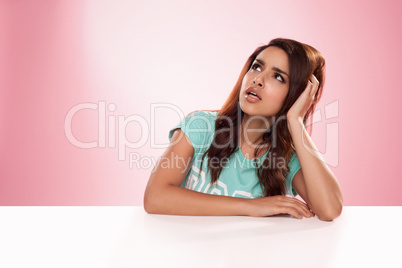 beautiful woman sitting thinking