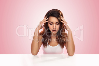 depressed woman sitting at a table