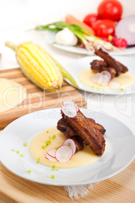 pork ribbs on polenta corn cream bed