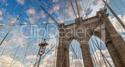 Brooklyn Bridge, New York City. Upward view with beautiful sky c