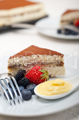 tiramisu dessert with berries and cream