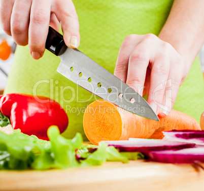 Woman's hands cutting vegetables