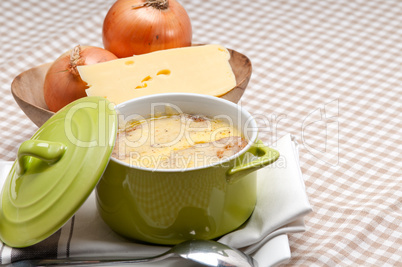 onion soup with melted cheese and bread on top