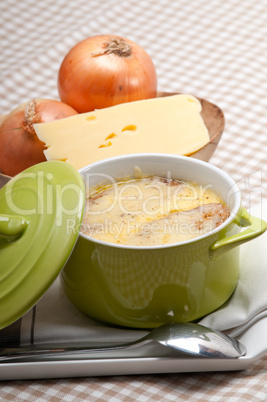 onion soup with melted cheese and bread on top