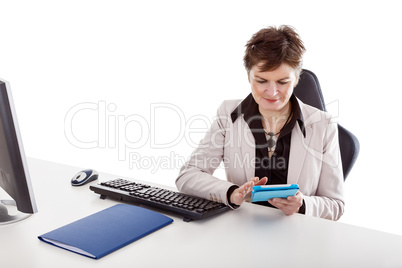 Businesswoman in office with tablet PC