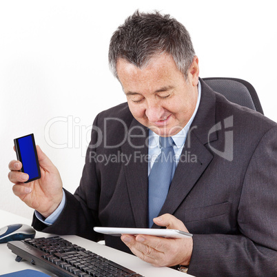 Businessman in office with tablet PC