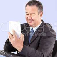 Businessman in office with tablet PC