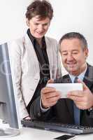 Businessman and businesswoman with tablet PC
