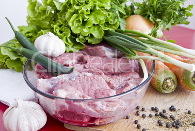 Beef meat on table and vegetables