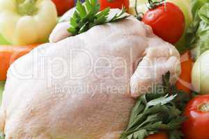 whole raw chicken with vegetables