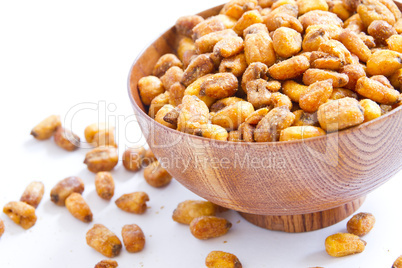 A cherry wood bowl of corn grains