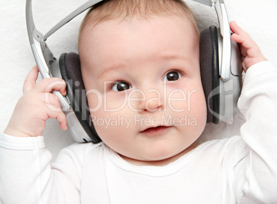 baby listening music on back
