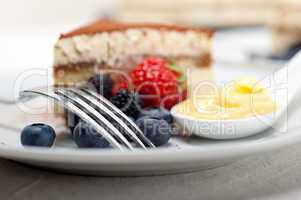 tiramisu dessert with berries and cream