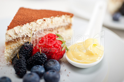 tiramisu dessert with berries and cream