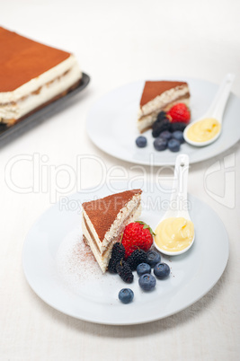 tiramisu dessert with berries and cream