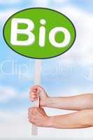 Hands holding a sign with the word bio