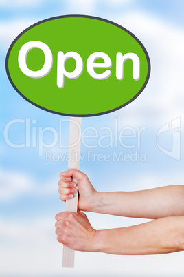 Hands holding a sign with the word open