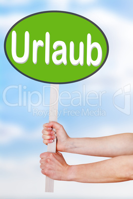 Hands holding a sign with the word urlaub