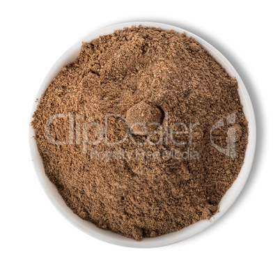 Ground pepper in plate isolated
